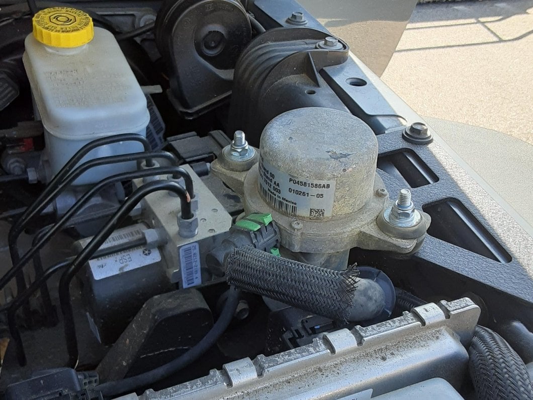 Barricade Vacuum Canister Relocation Bracket (07-18 Jeep Wrangler JK)