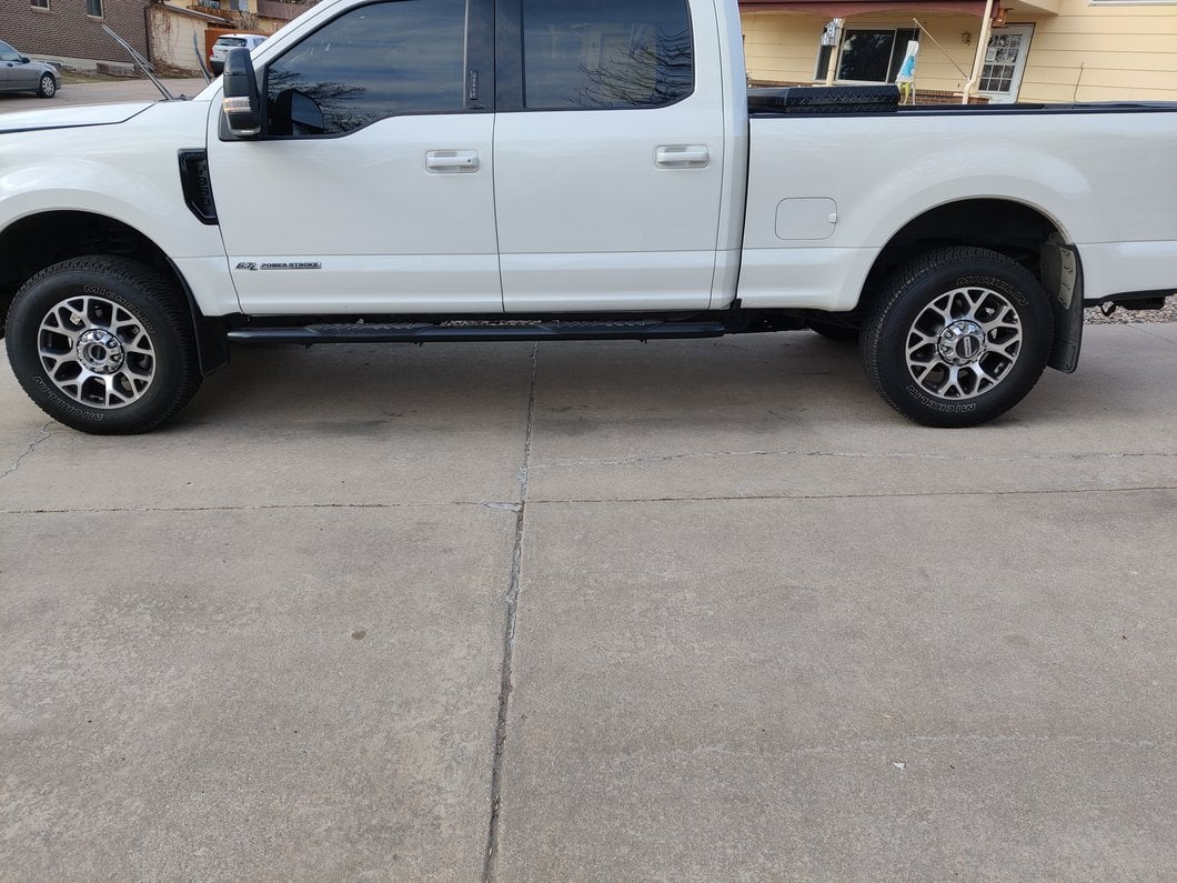 Barricade 5-Inch Oval 60 Degree Bent End Side Step Bars; Black (17-25 F-250 Super Duty SuperCrew)